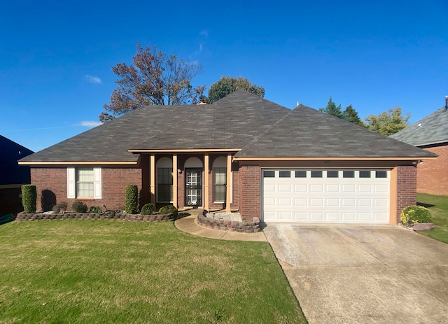 ranch-style home with a front yard and a garage