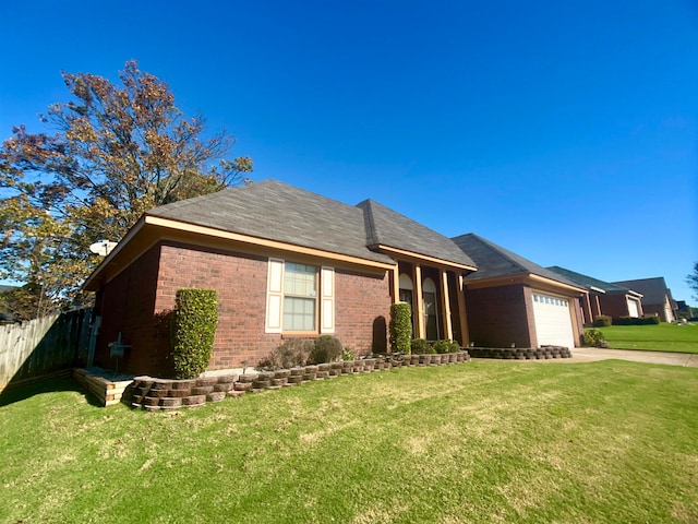 view of front of house with a front lawn and a garage