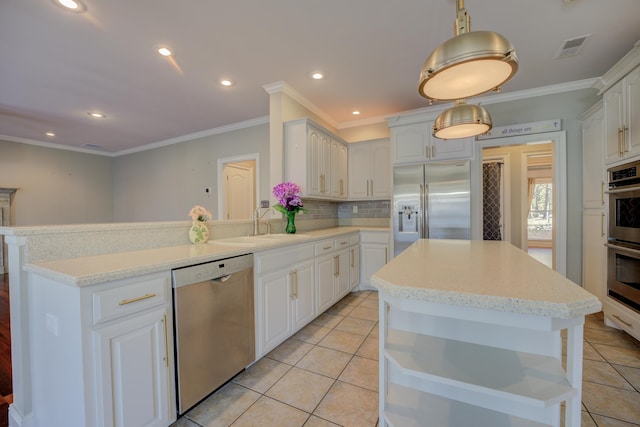 kitchen featuring white cabinetry, stainless steel appliances, pendant lighting, decorative backsplash, and light tile patterned floors