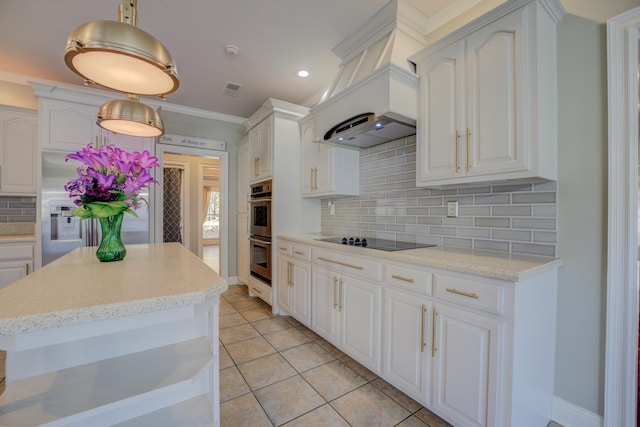 kitchen with tasteful backsplash, stainless steel appliances, white cabinetry, hanging light fixtures, and light tile patterned flooring