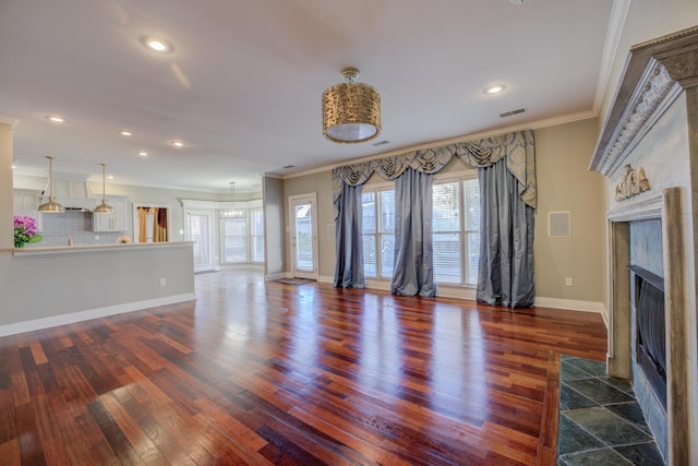 unfurnished living room with a fireplace, dark wood-type flooring, and ornamental molding