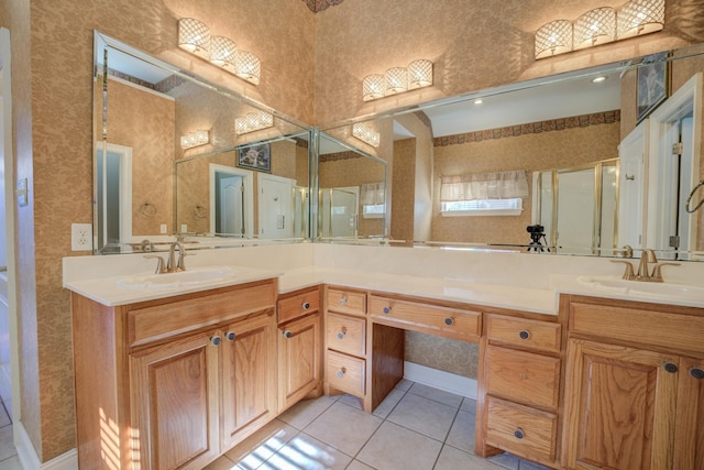 bathroom with tile patterned floors, vanity, and an enclosed shower