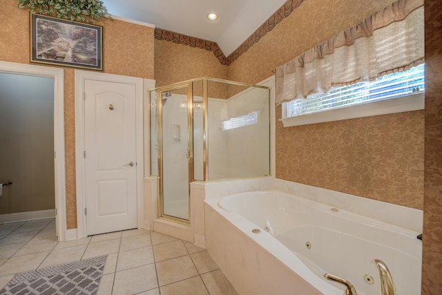 bathroom with separate shower and tub and tile patterned flooring