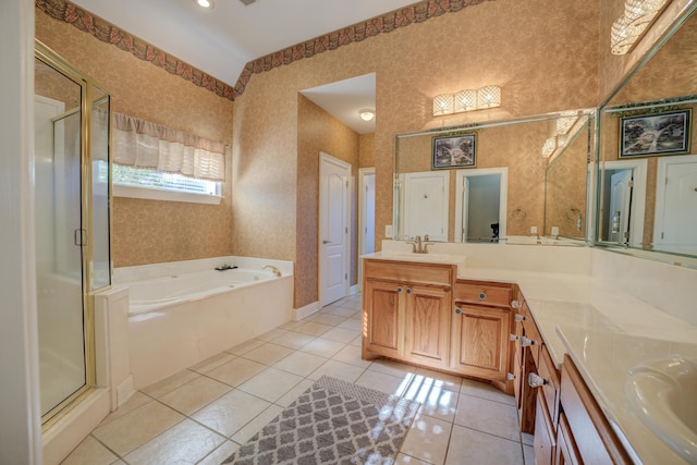 bathroom with tile patterned floors, vanity, and separate shower and tub