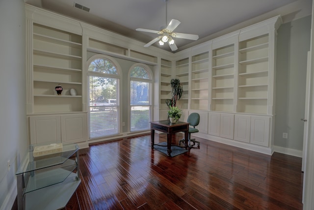 office space with ceiling fan, dark hardwood / wood-style flooring, and built in features