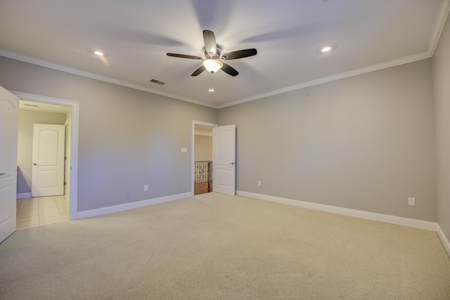 unfurnished bedroom with ceiling fan, crown molding, and light carpet