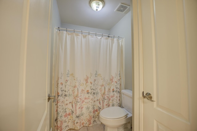 bathroom featuring tile patterned floors and toilet