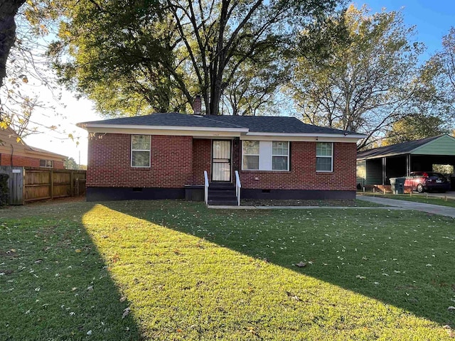 view of front facade with a front lawn and a carport