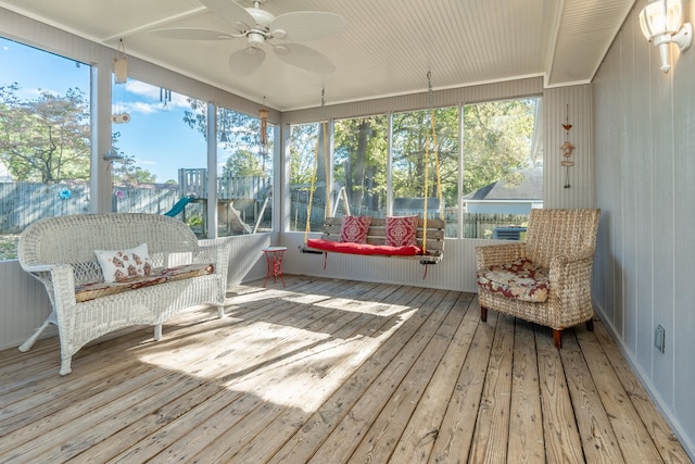 sunroom / solarium with ceiling fan