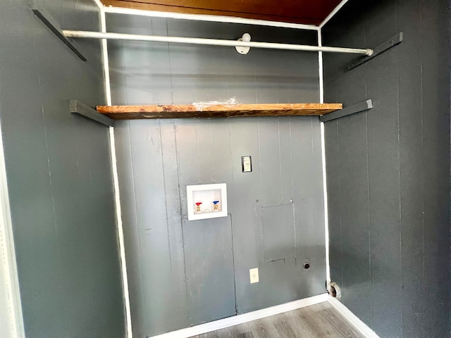 clothes washing area with washer hookup, electric dryer hookup, and wood-type flooring