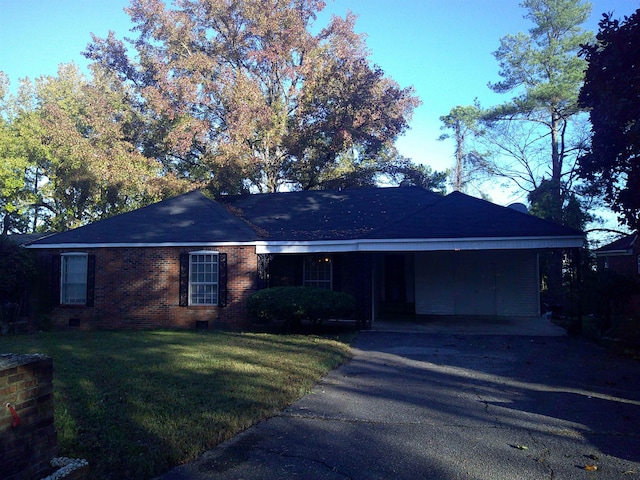 single story home featuring a front yard and a carport