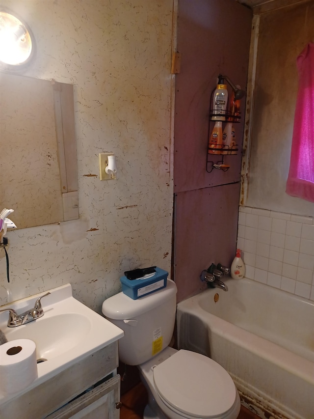 full bathroom featuring vanity,  shower combination, and toilet