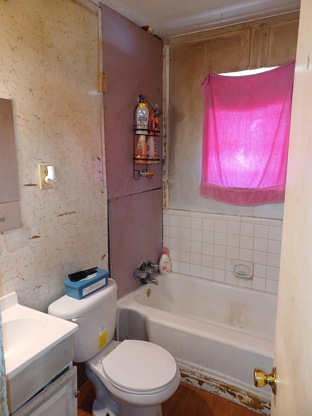 full bathroom featuring hardwood / wood-style flooring, vanity, shower / bathtub combination, and toilet