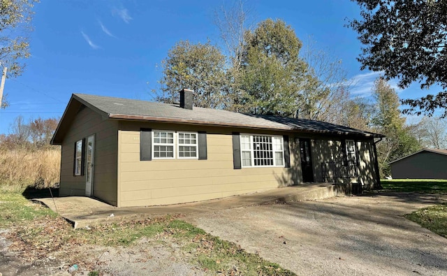 view of side of home with a patio area