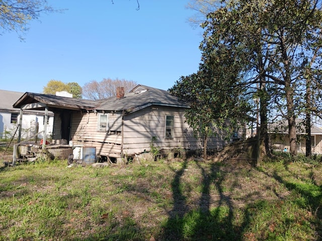 1327 Nicholas St, Memphis, TN 38107 - view of side of property featuring a chimney