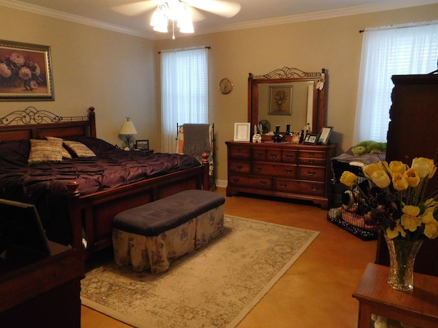 carpeted bedroom featuring ornamental molding and ceiling fan