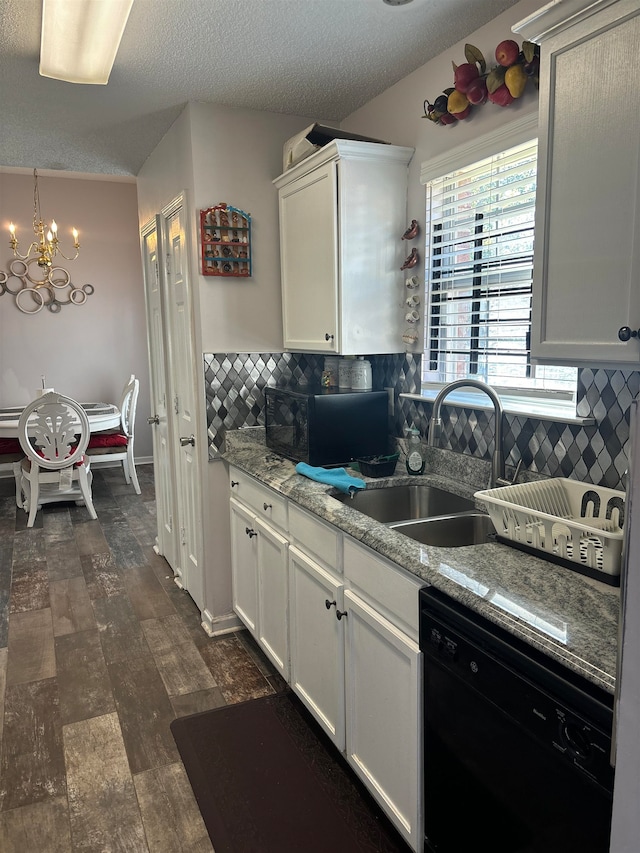 kitchen featuring decorative backsplash, light stone countertops, dark hardwood / wood-style flooring, sink, and dishwasher