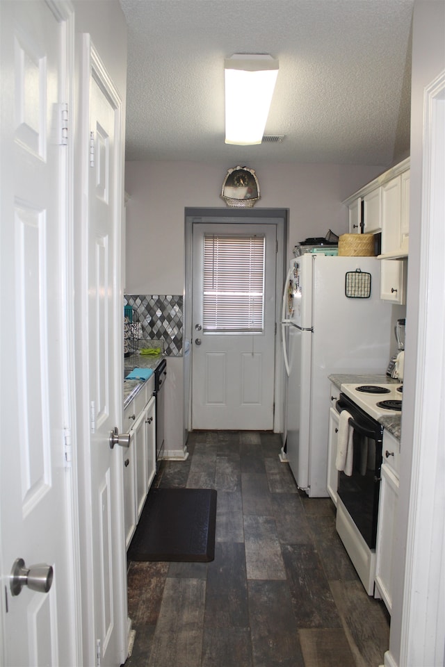 kitchen with stainless steel dishwasher, white cabinetry, electric stove, and a textured ceiling