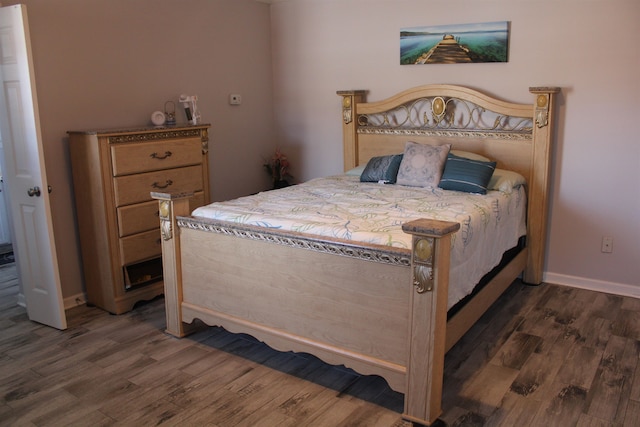 bedroom featuring dark hardwood / wood-style flooring