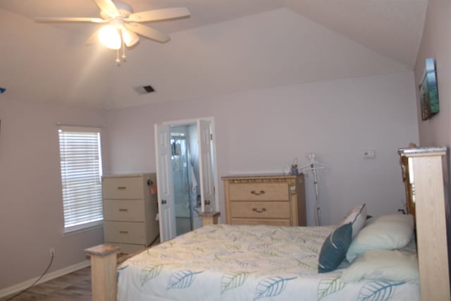 bedroom with hardwood / wood-style floors, ceiling fan, and lofted ceiling