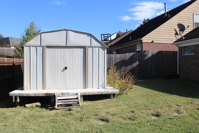 view of outbuilding featuring a lawn