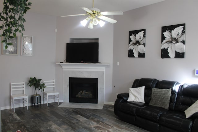 living room with dark hardwood / wood-style floors and ceiling fan