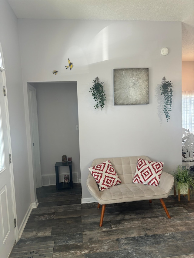 living area featuring dark wood-type flooring