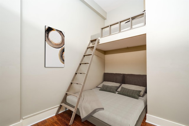 71 Union Ave Unit 102, Memphis, TN 38103 - bedroom featuring wood finished floors, baseboards, beam ceiling, and a high ceiling