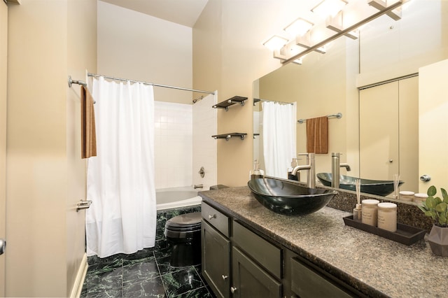 full bathroom featuring shower / tub combo, vanity, and toilet