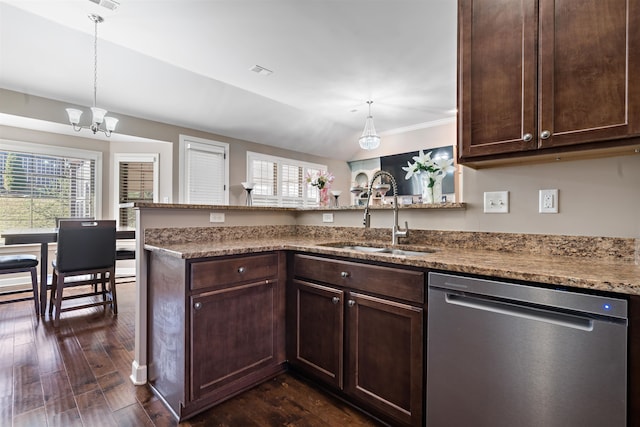 kitchen with kitchen peninsula, dark hardwood / wood-style floors, stainless steel dishwasher, and sink