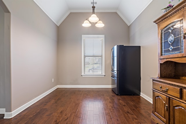 interior space with stainless steel fridge, crown molding, dark wood-type flooring, and vaulted ceiling