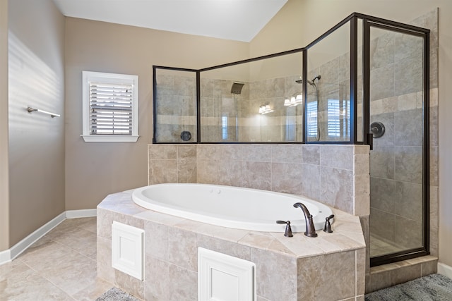 bathroom with separate shower and tub, tile patterned floors, and lofted ceiling