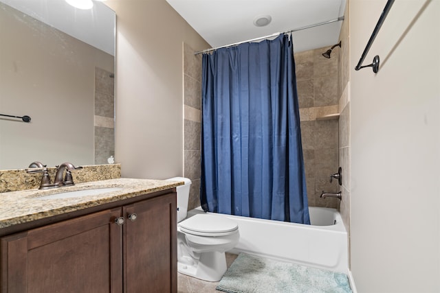 full bathroom with tile patterned floors, shower / bath combo, toilet, and vanity