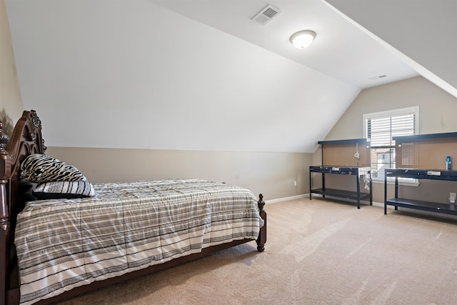 carpeted bedroom featuring lofted ceiling