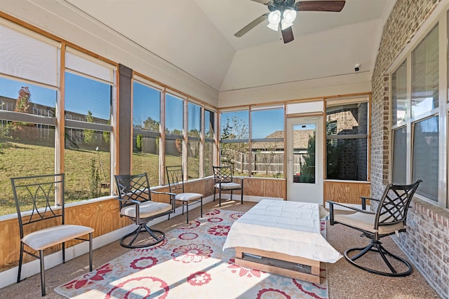 sunroom featuring ceiling fan and lofted ceiling