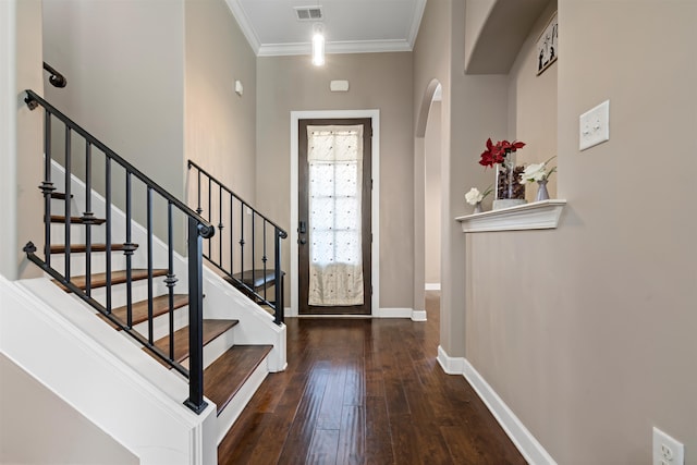 entryway featuring dark hardwood / wood-style floors and ornamental molding