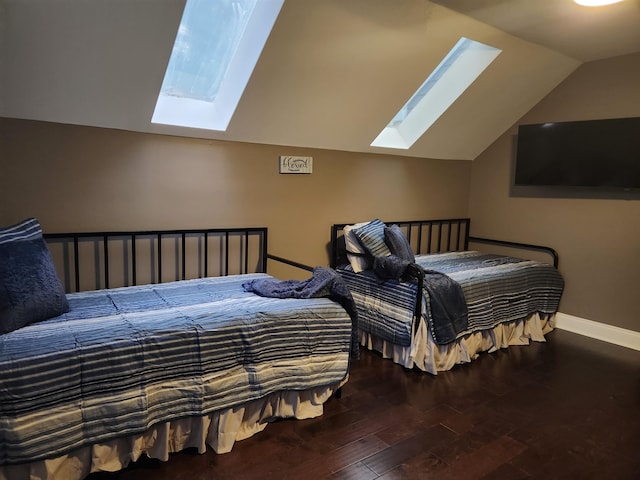 bedroom featuring wood-type flooring and vaulted ceiling