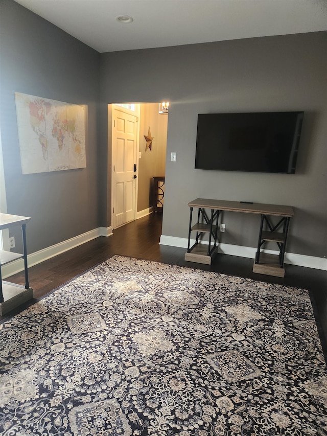 living room with dark hardwood / wood-style flooring