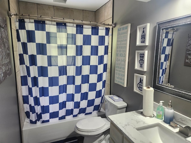 full bathroom featuring shower / tub combo, vanity, and toilet