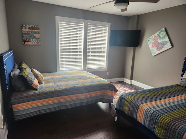 bedroom with wood-type flooring and ceiling fan