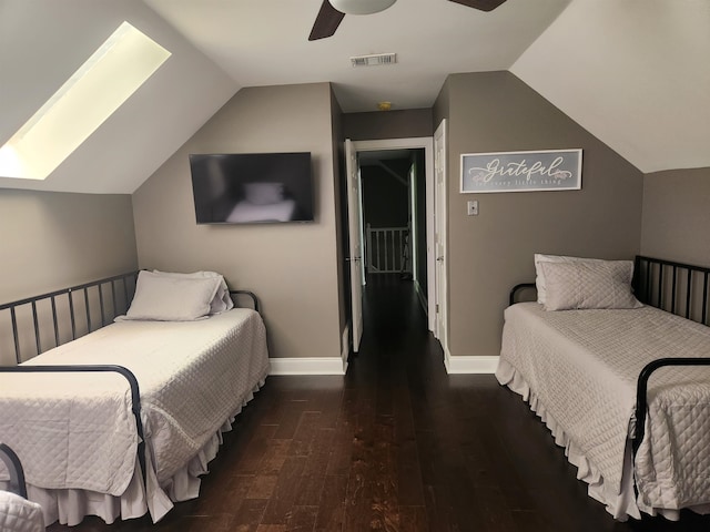 bedroom with ceiling fan, dark wood-type flooring, and lofted ceiling