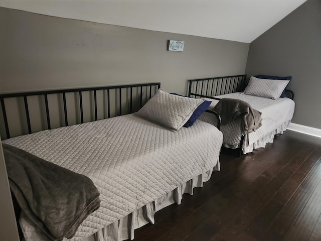 bedroom featuring dark wood-type flooring