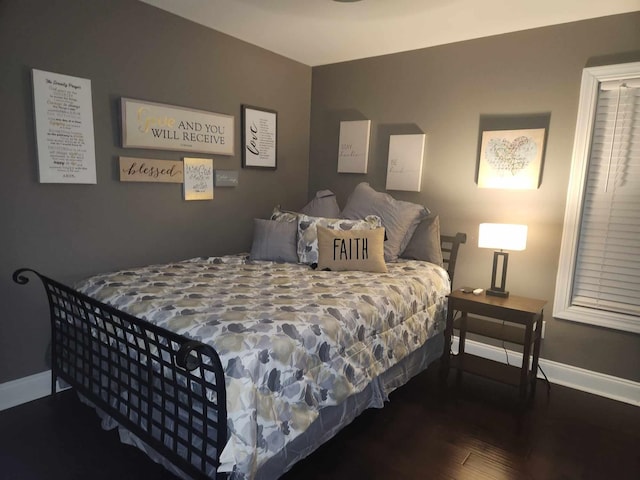 bedroom with hardwood / wood-style flooring