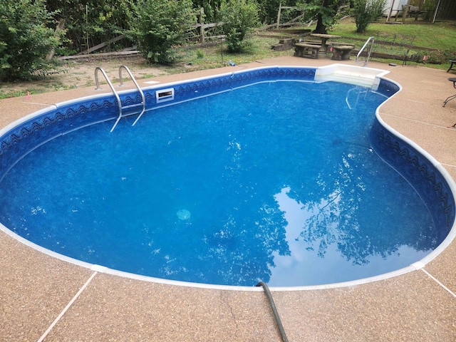 view of pool featuring a patio area