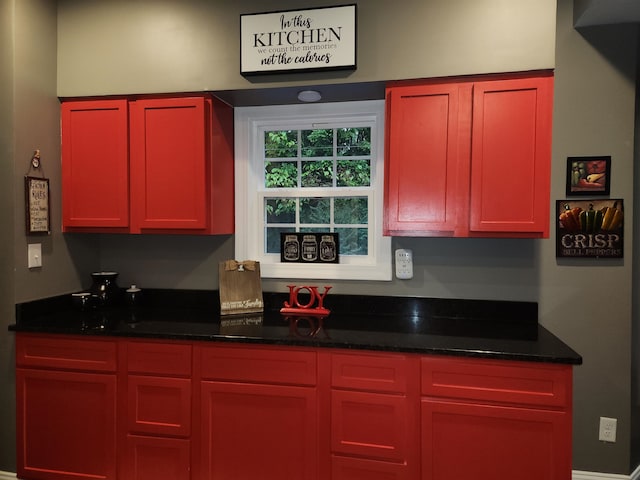 kitchen with dark stone countertops