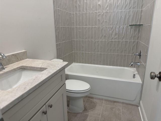 bathroom featuring vanity, tub / shower combination, tile patterned flooring, and toilet