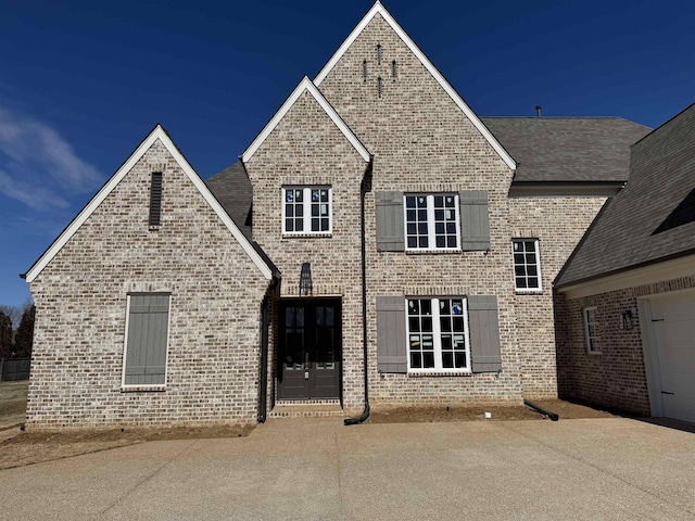 view of front of house with brick siding