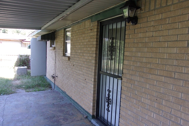 view of side of property featuring central air condition unit