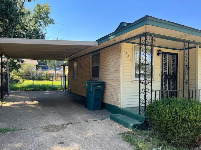 view of property exterior featuring a carport