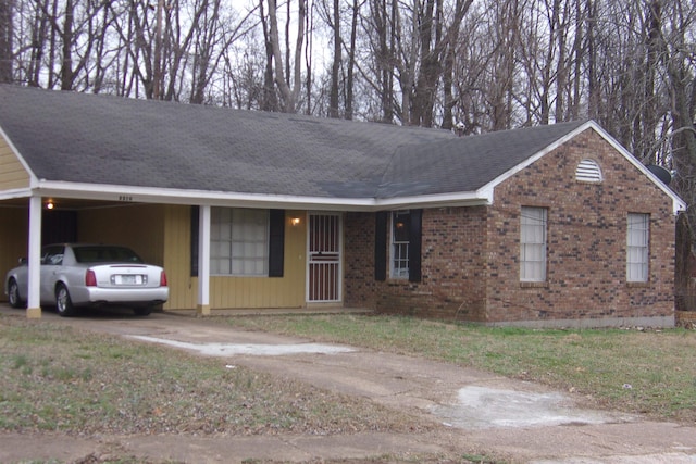 ranch-style house with a carport